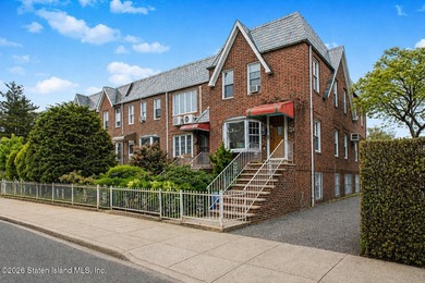 Located at 1879 Haring Street, this full brick end-unit - photo 3