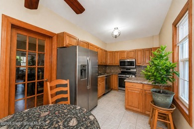 Located at 1879 Haring Street, this full brick end-unit - photo 10