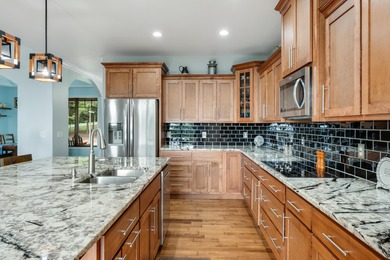 Custom built home meticulously maintained with an abundance of - photo 17