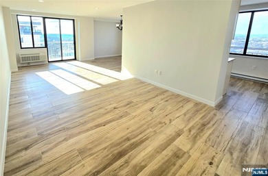 Step inside this Stunning, Custom, Top Floor Corner Unit and