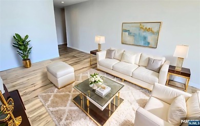 Step inside this Stunning, Custom, Top Floor Corner Unit and