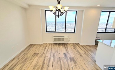 Step inside this Stunning, Custom, Top Floor Corner Unit and