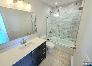 Step inside this Stunning, Custom, Top Floor Corner Unit and