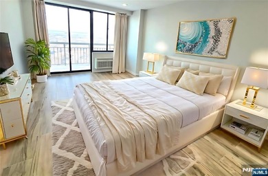 Step inside this Stunning, Custom, Top Floor Corner Unit and