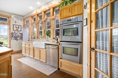 Sophisticated coastal living overlooking Devils Lake, set on a - photo 7