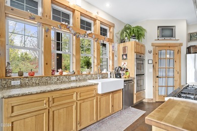 Sophisticated coastal living overlooking Devils Lake, set on a - photo 8