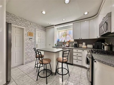 Stunning detached two-family home situated in the highly - photo 5