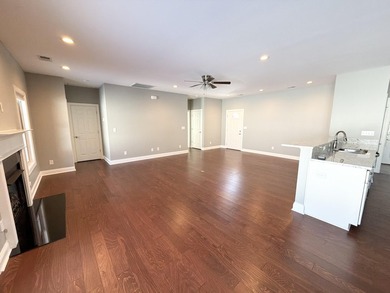 The spacious, open floor plan includes hardwood flooring, gas - photo 6
