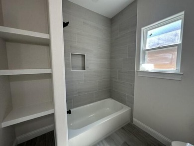 Another stunning creation by Deluxe Custom Homes! This 4-bedroom - photo 12