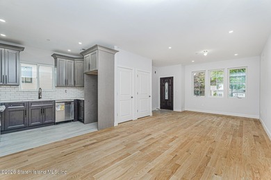Welcome to this brand-new construction 7-over-7 two-family home - photo 4