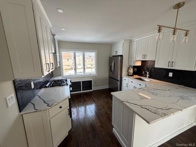 An absolute magnificent completely redone waterfront home in - photo 3