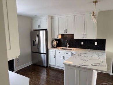 An absolute magnificent completely redone waterfront home in - photo 5