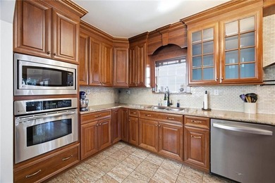 Welcome to this beautiful detached one-family home in the highly - photo 8