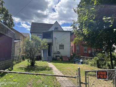 This duplex features 1 bedroom, 1 full bathroom downstairs with - photo 3