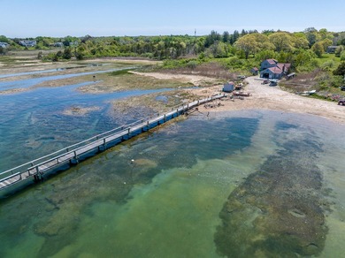 Set along the shores of Barnstable Harbor at the end of a - photo 4