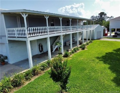 Discover laid-back living in this elevated 2-bedroom, 2-bath - Lake Home For Sale in Sulphur, Louisiana