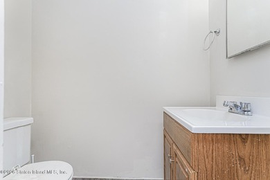 Welcome to 73 Gary Place! This large 2-family, semi-attached - photo 6