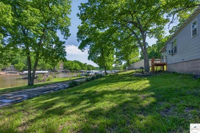 Tucked away in a quiet lakeside subdivision, this charming - photo 3