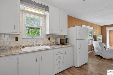 Tucked away in a quiet lakeside subdivision, this charming - photo 8