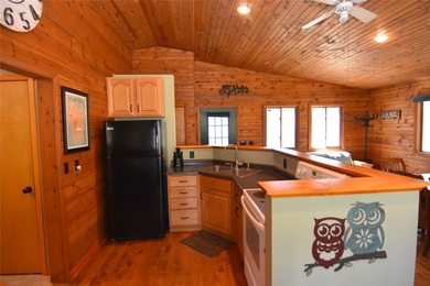 Nestled among mature pines and hardwoods, this adorable cabin - photo 18