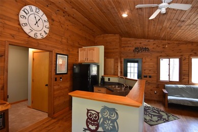 Nestled among mature pines and hardwoods, this adorable cabin - photo 19