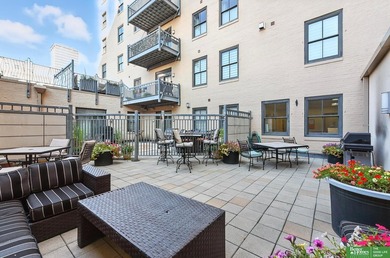 Don't miss this corner unit condo in The Paxton, a landmark - photo 24