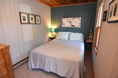 Nestled among mature pines and hardwoods, this adorable cabin - photo 25