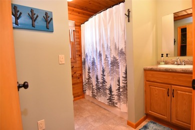 Nestled among mature pines and hardwoods, this adorable cabin - photo 26