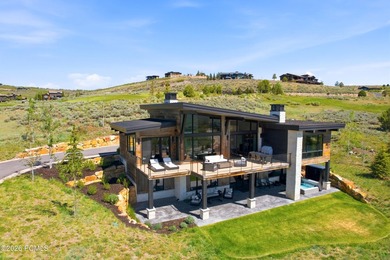 Situated within the gated community of Tuhaye, this custom - photo 1
