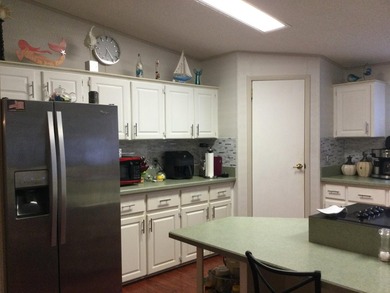 ONE OF THE LARGEST HOMES IN THIS COMMUNITY. THIS 1560 SF HOME IS - photo 5