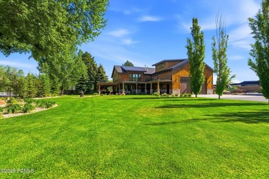 Nestled on an extraordinary 1.17-acre parcel in the charming - photo 2