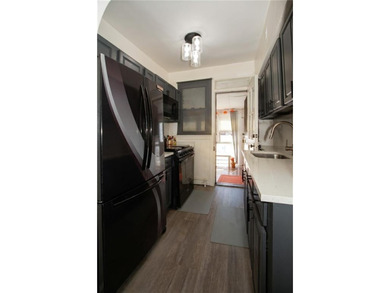 Welcome to this well-maintained brick one-family home offering - photo 5