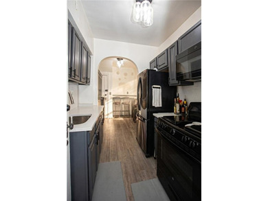 Welcome to this well-maintained brick one-family home offering - photo 6