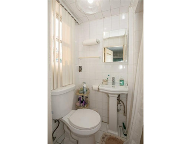 Welcome to this well-maintained brick one-family home offering - photo 8