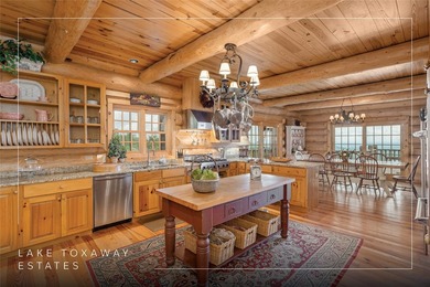 Perched atop over 12 secluded acres, this majestic log cabin - photo 4