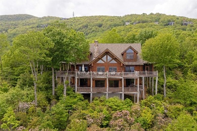 Perched atop over 12 secluded acres, this majestic log cabin - photo 7