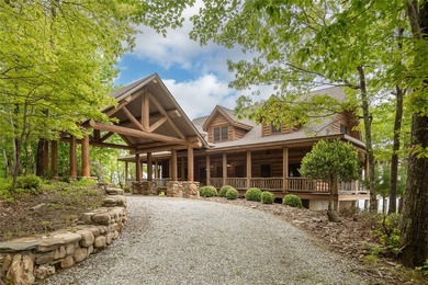 Perched atop over 12 secluded acres, this majestic log cabin - photo 9