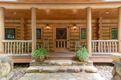 Perched atop over 12 secluded acres, this majestic log cabin - photo 10