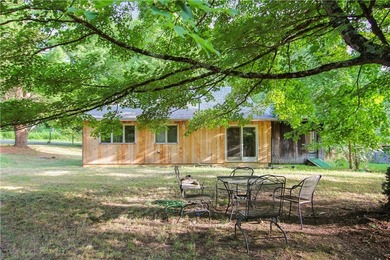 Beautiful contemporary home tucked into the woods with a creek - photo 27