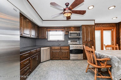 Welcome to 509 Eltingville Blvd, a charming single-family home - photo 4