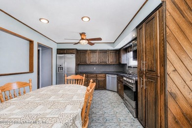 Welcome to 509 Eltingville Blvd, a charming single-family home - photo 5