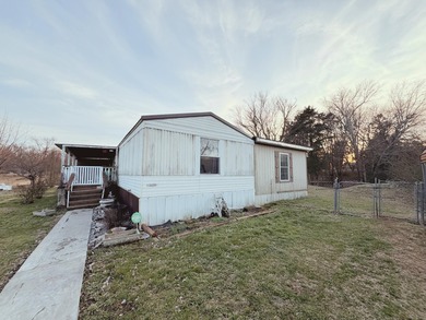 Located at 25 Don Grider Road in Russell Springs, KY, this 2005