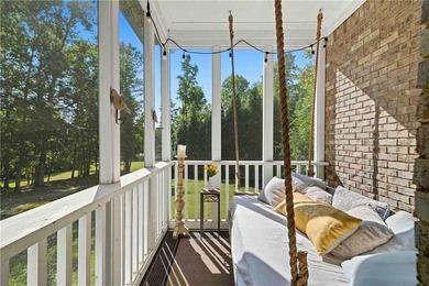 Discover one of McDonough's most exclusive gated estates, where - photo 2