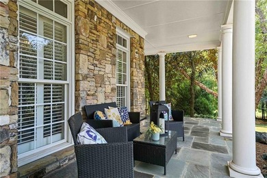 Discover one of McDonough's most exclusive gated estates, where - photo 3