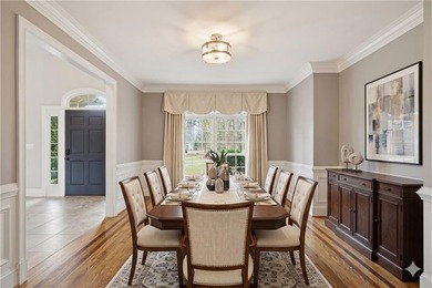 Discover one of McDonough's most exclusive gated estates, where - photo 5