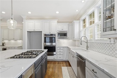 Discover one of McDonough's most exclusive gated estates, where - photo 9