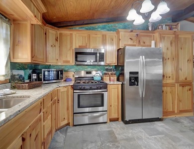 Lakefront Living Meets Total Utility: Interior: Knotty Pine - photo 11