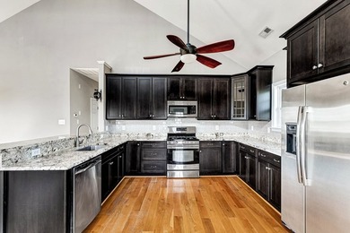 Experience true waterfront living with this custom-built - photo 13