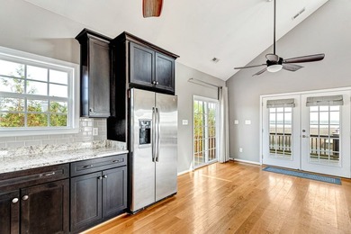 Experience true waterfront living with this custom-built - photo 16