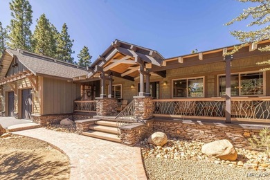 This breathtaking custom Craftsman home is tucked away on a - photo 1